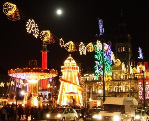 Christmas funfair In George Square. Glasgow City Chambers can be seen beyond.