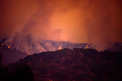 Smoke and fire in the woods near Los Angeles